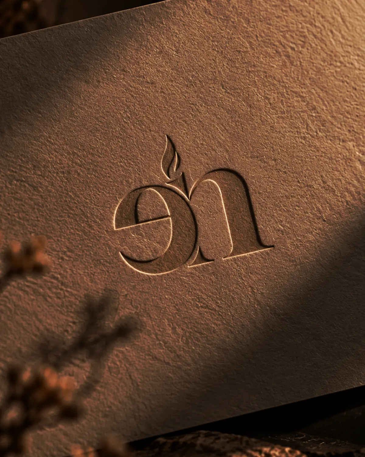 Evenin Notes home fragrance logo embossed on textured packaging